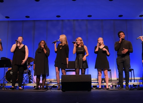 Group of performers on stage