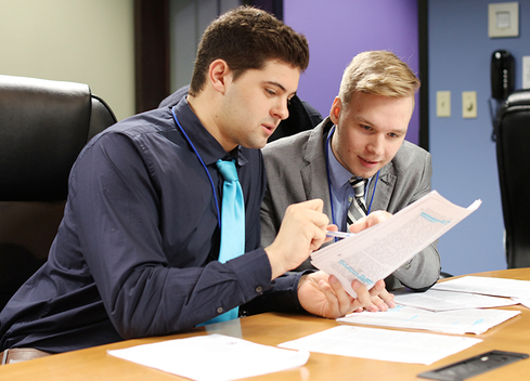 Two Students at a desk collaborating