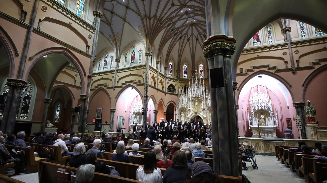 Interior of St. Patrick Church with the University Choir singing