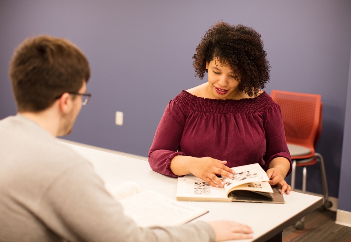 Students using archival materials for research