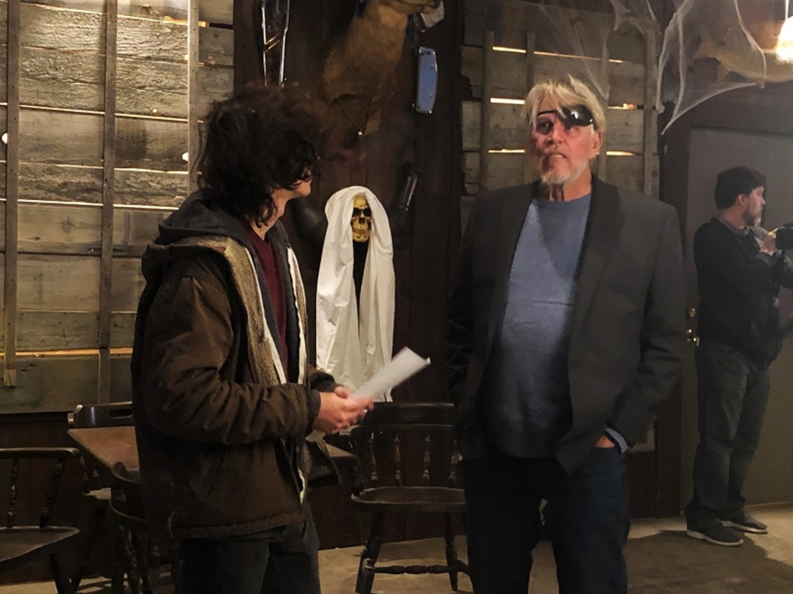 Zachary Cook script supervising on the set of &quot;Trick and Treats&quot; with Gary Busey.