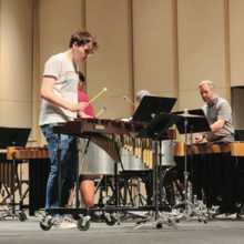 students playing percussion