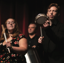 students playing percussion